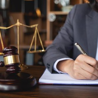 Judge gavel with Justice lawyers, Business woman in suit or lawyer working on a documents. Legal law, advice and justice concept.