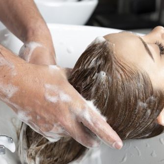 Woman is having a hair wash.